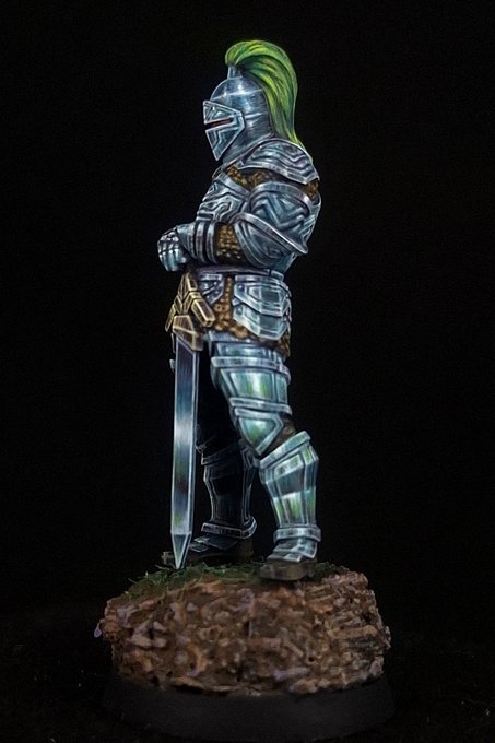The knight in profile with the sword blade seen full length. A bright band runs down the upper plane, a hard horizon line marks where the reflection flips from sky to ground, the lower plane stays dark for most of its area, and a hairline of near-white follows the cutting edge from guard to point.
