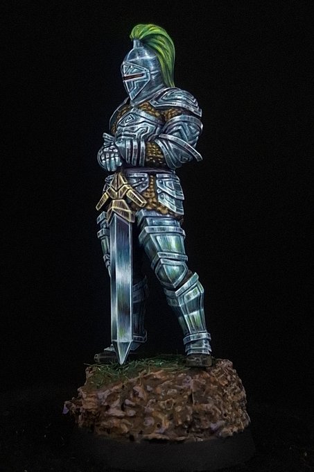 The same knight from three-quarters, showing one light source held across every curved plate at once. The pauldron, the breastplate, the thigh plate and the greave each carry their bright band high and on the same side, with the dark mass beneath and a bounce highlight along the lower lip - which is what makes separately shaded plates read as one object under one lamp.